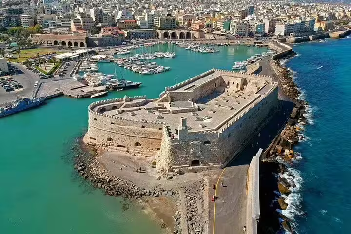 Aerial view of Heraklion's Venetian Harbor and Fortress, a highlight on the scenic wine tasting journey through Crete's villages.