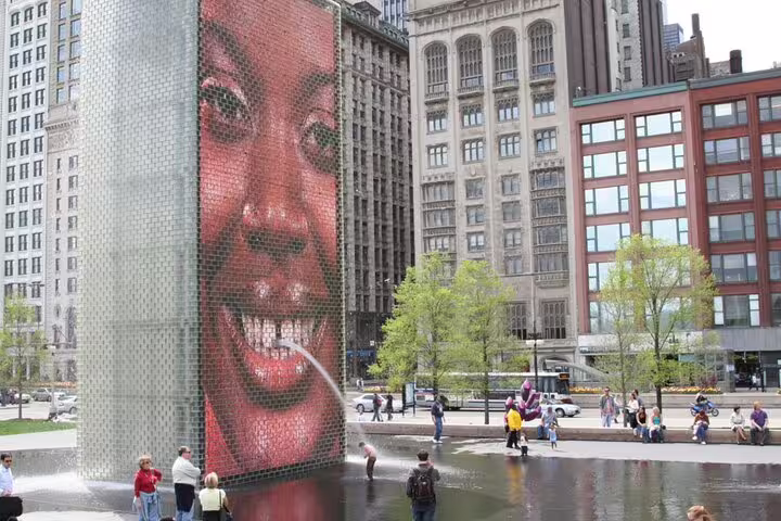 Crown Fountain mosaic face sculpture spraying water in Millennium Park, Chicago