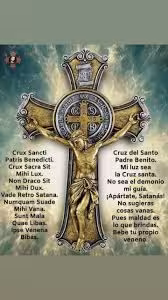 A detailed crucifix with Latin exorcism prayers highlights the spiritual theme of the Barcelona exorcism tour.