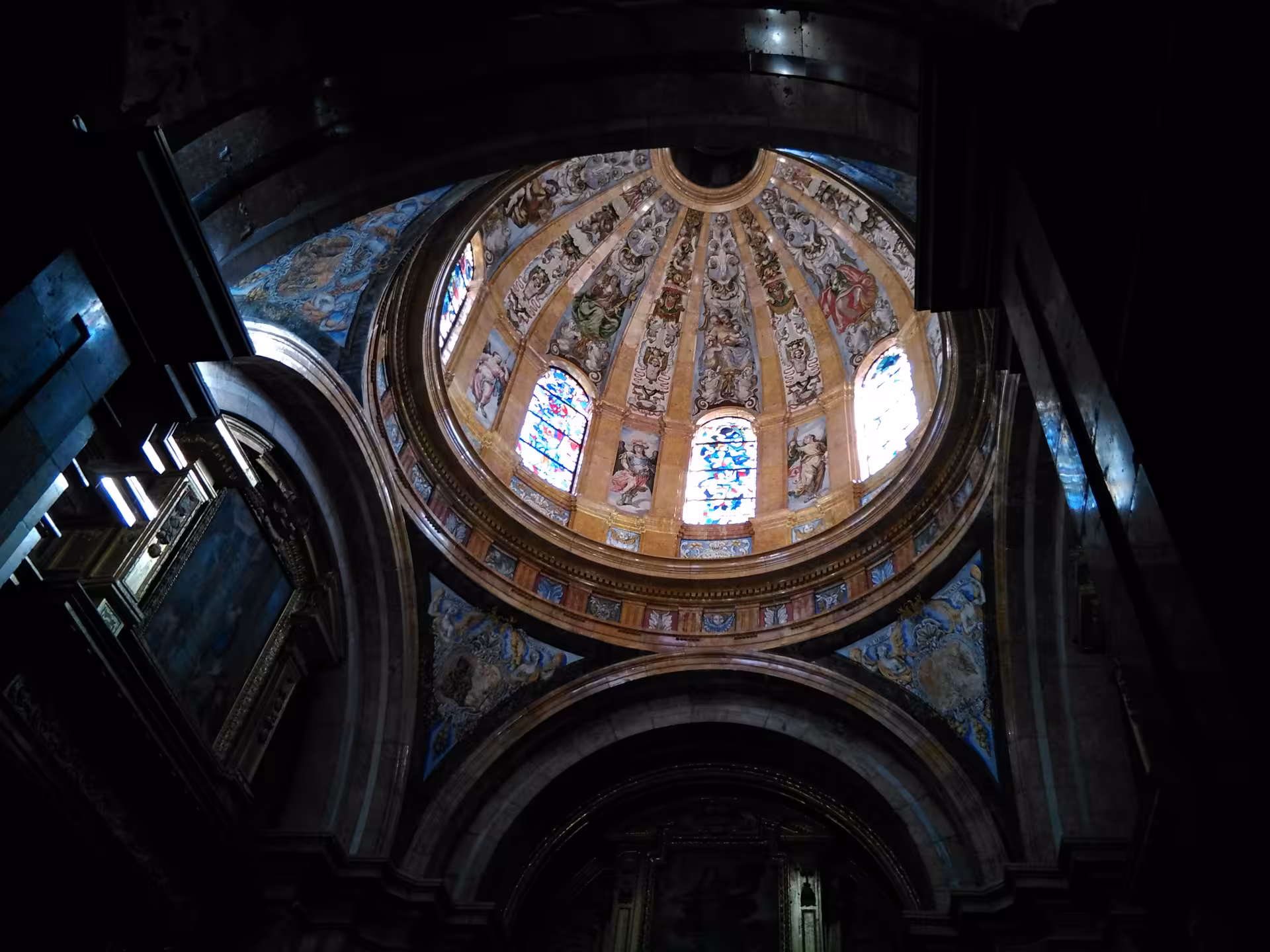 Painted dome and stained-glass windows inside Cuenca Cathedral, a highlight of the Madrid to Cuenca excursion