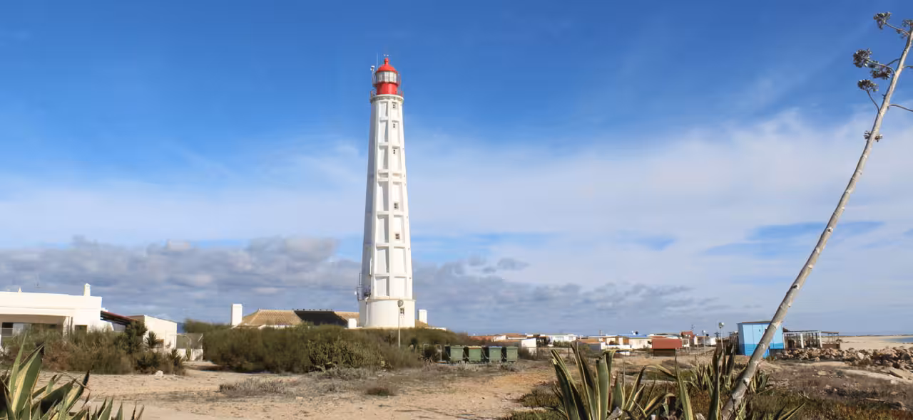 Culatra Island lighthouse in Ria Formosa near Faro, landmark view on the 2-stop 2-islands boat tour