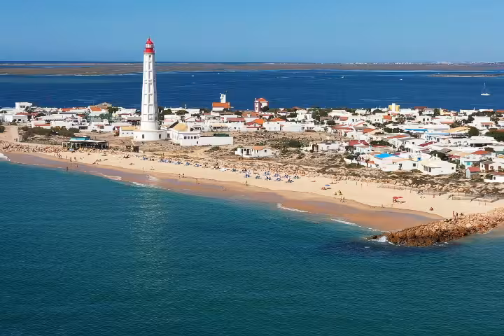 Aerial view of Culatra Island beach and lighthouse in Ria Formosa, stop on the 3-island full-day boat tour