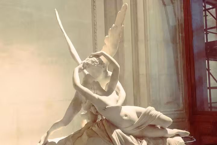 Marble sculpture of Cupid and Psyche embracing, a hidden gem at the Louvre Museum in Paris