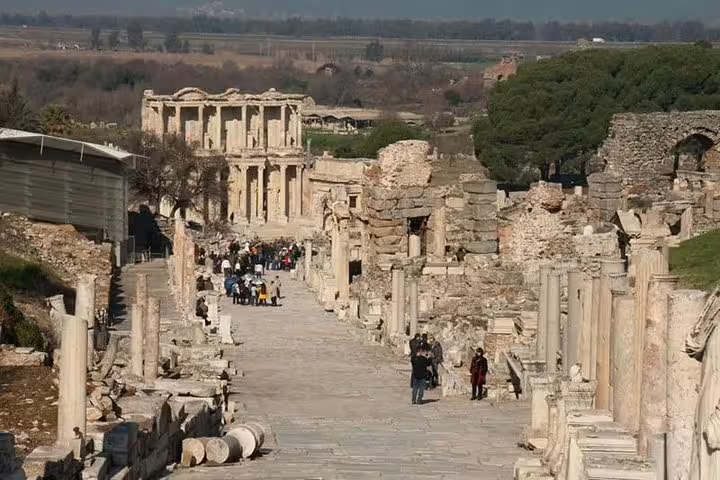 Walk through the iconic Curetes Street in Ephesus, featuring ancient ruins and the Library of Celsus on this Kusadasi tour.