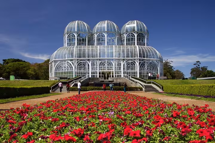 Visit Curitiba's stunning Botanical Garden with its iconic greenhouse and vibrant flower beds on our full-day city tour.