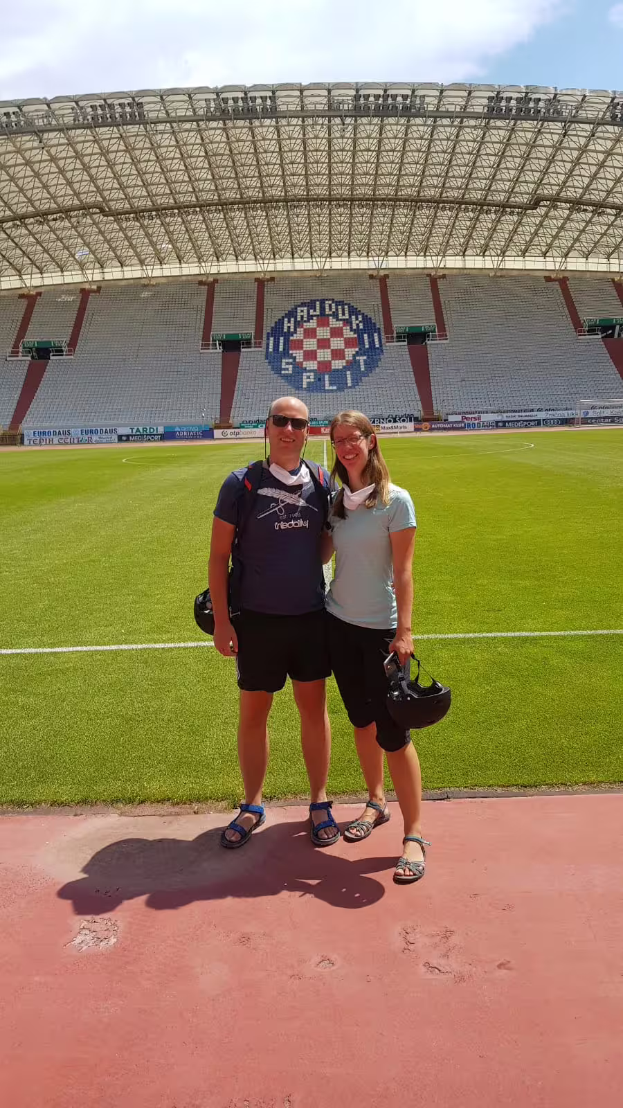 Cyclists posing on the pitch at Poljud Stadium Split during Bike, Beer & stadium tour in Croatia