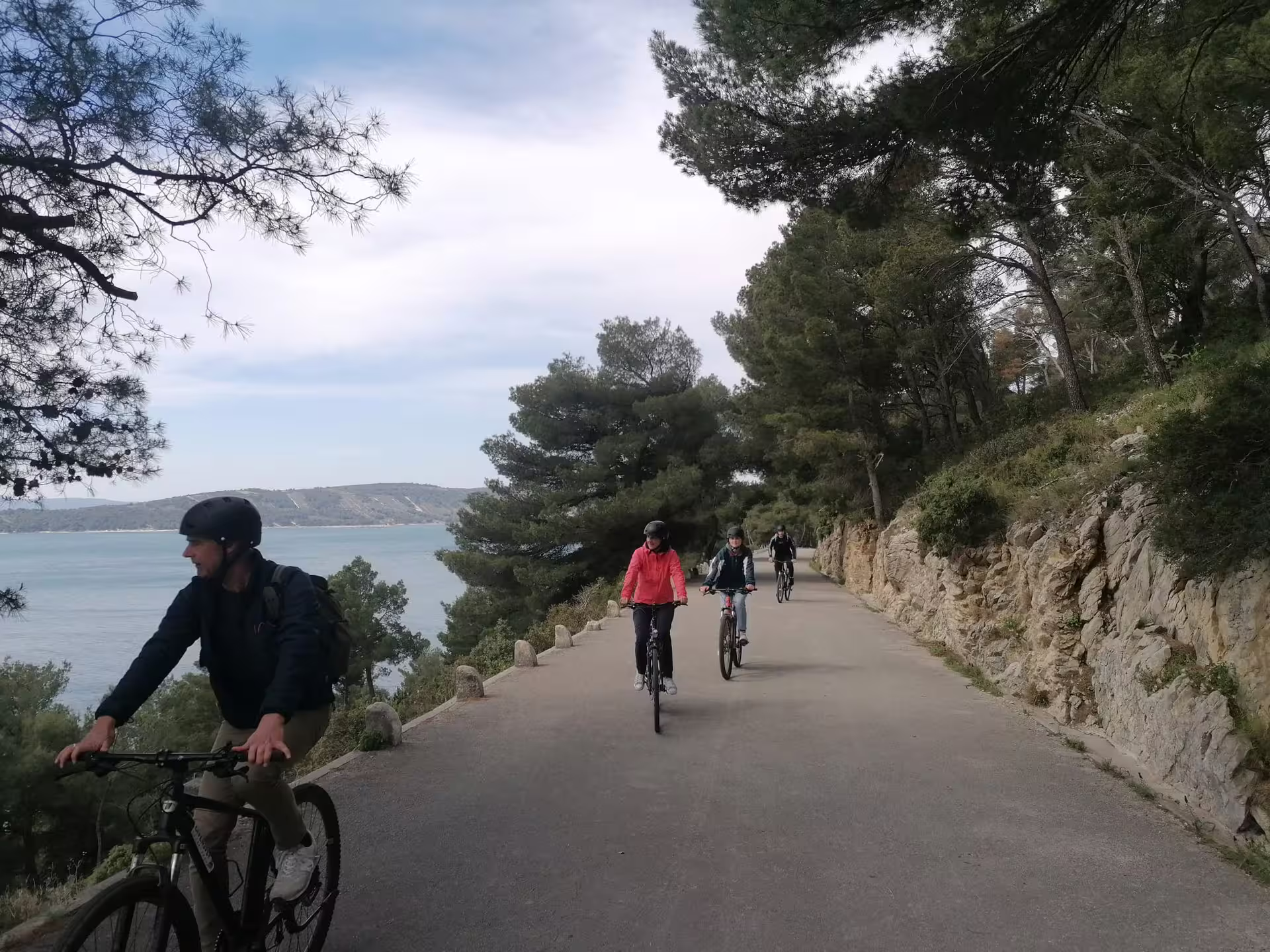 Cyclists ride a scenic Split seaside path on the Bike, Beer & Poljud Stadium Tour along the Adriatic coast