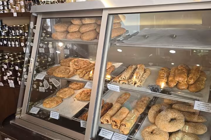Bakery display of Cypriot pastries and sesame bread, a tasty stop on Troodos and Kykkos tour from Paphos