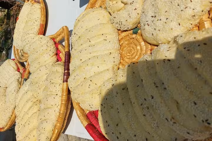 Freshly made Cypriot village breads in woven baskets, part of authentic cooking workshop and wine tasting