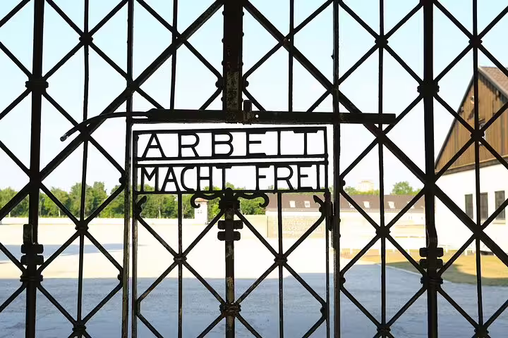 Historic gate at Dachau Concentration Camp Memorial Site, a poignant stop on the Dachau and Munich car tour.