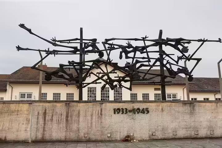 Powerful sculpture at Dachau Memorial, commemorating Holocaust victims, featured on the Dachau and Munich car tour.