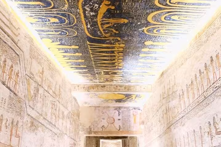 Painted ceiling and hieroglyph walls inside an ancient Egyptian tomb on a 5 day 4 night Dahabiya Nile cruise