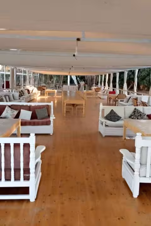 Dahabiya Nile cruise sun deck lounge with shaded seating, relaxing on 5 days 4 nights Egypt itinerary