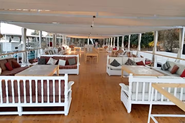 Spacious dahabiya sundeck lounge with sofas on a 5 days 4 nights Nile cruise in Egypt