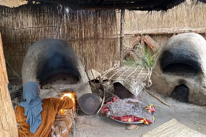 Traditional Dahshur countryside bakery with twin clay ovens and fire, part of a day like a farmer tour with locals