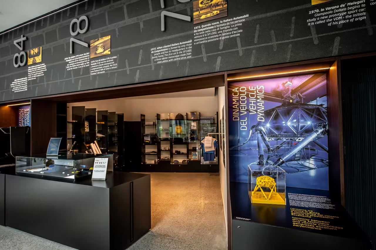 Explore vehicle dynamics displays at Dallara Academy in Parma, highlighting motorsport engineering excellence.