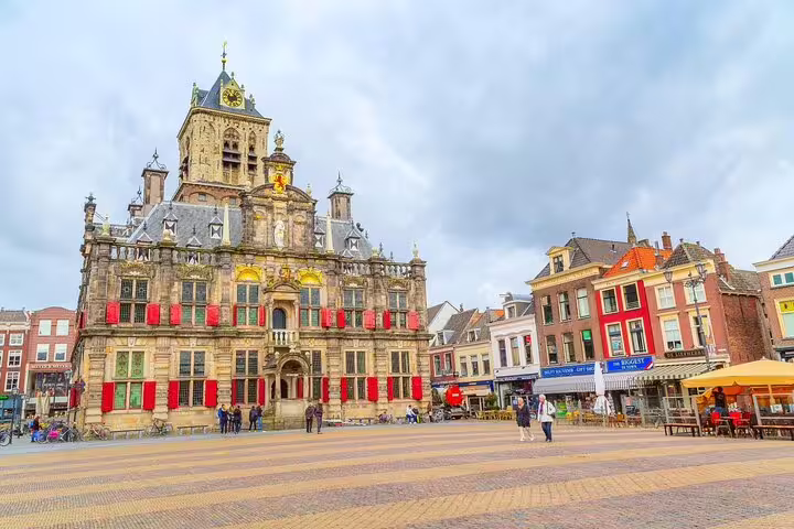 Delft City Hall with red shutters on the Markt square, Netherlands