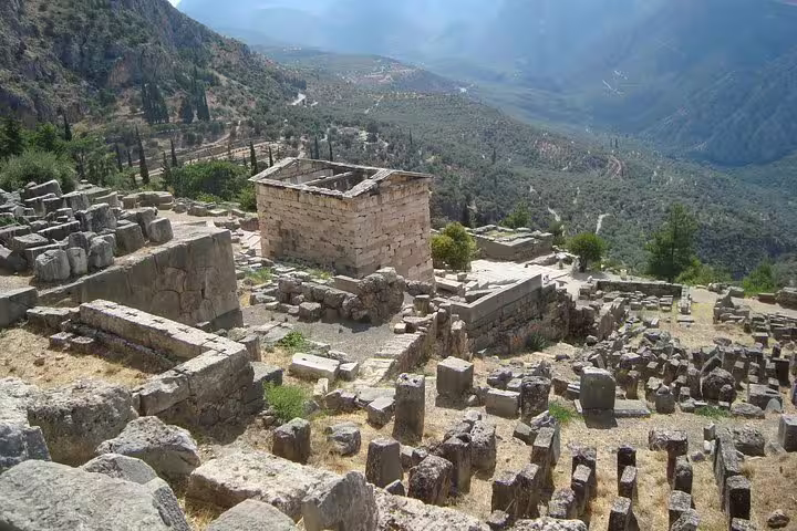 Ancient Delphi archaeological ruins overlooking the valley, key site on full day private tour from Athens