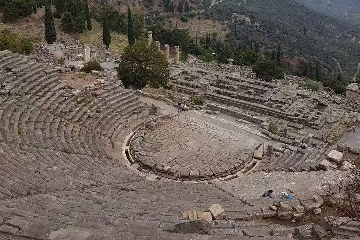 Ancient Delphi theater amphitheater overlooking sanctuary ruins, highlight of a guided private day tour from Athens