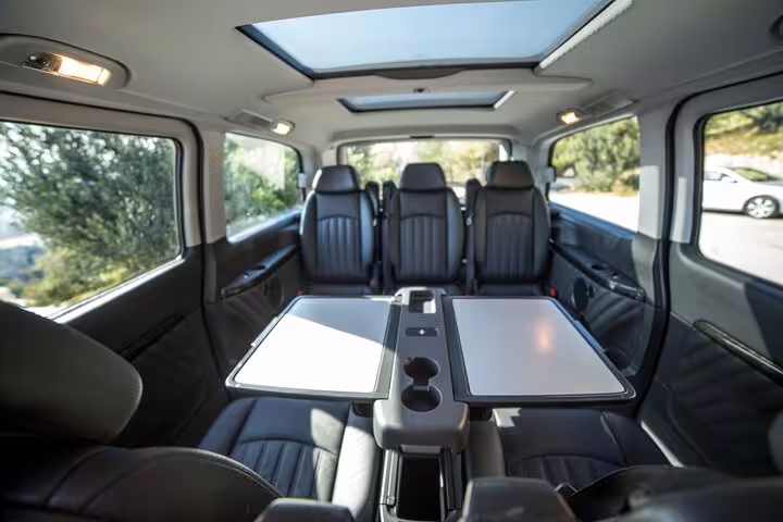 Spacious private van cabin with table seating and skylights for Delphi and Hosios Loukas Monastery tour from Athens