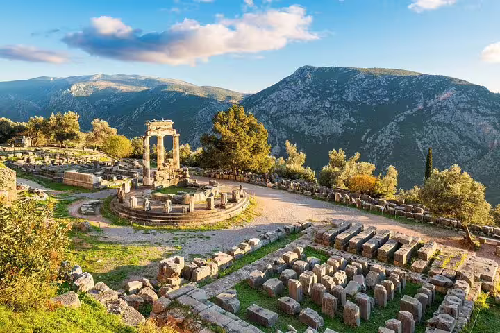 Delphi Sanctuary of Athena Pronaia ruins with mountain views, must-see stop on Delphi and Thermopylae tour