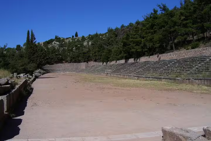 Ancient Delphi stadium track and stone seating on guided small group day tour from Athens, Greece