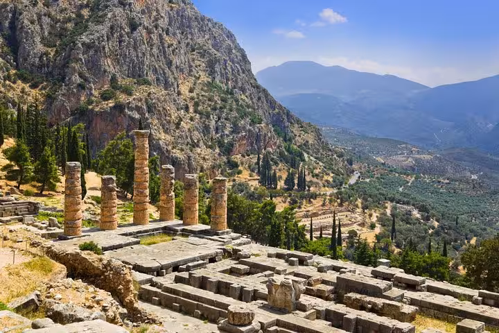 Delphi Temple of Apollo ruins overlooking Mount Parnassus valley on a luxury day tour from Athens
