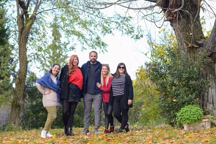 Private Delphi full-day tour from Athens group photo in nature, travelers enjoying a guided day trip in Greece