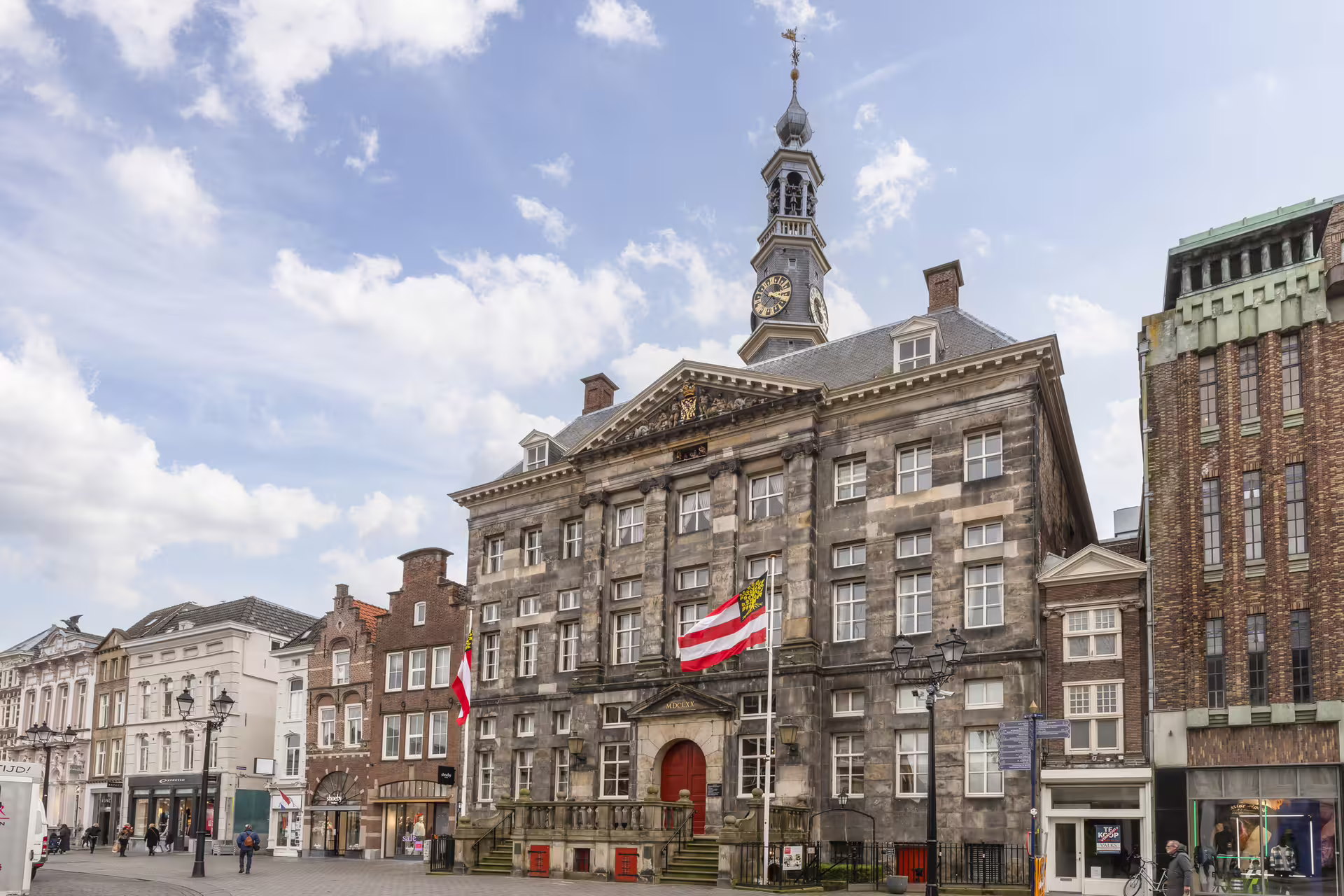 Den Bosch Market Square city hall facade and clock tower, key stop on 1-day walking tour audioguide