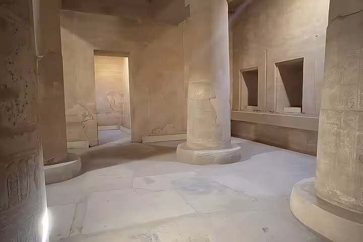 Inside Dendera Temple hall with massive columns and carved walls, featured on Dendera, Osireion & Abydos tour from Hurghada