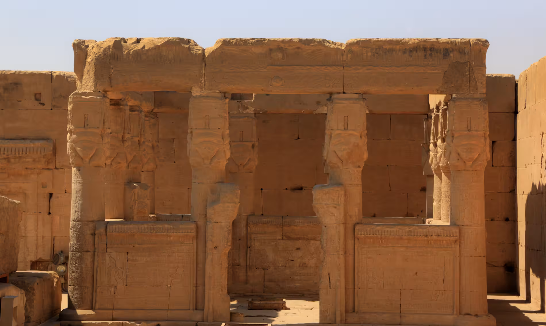 Ancient Dendera Temple columns with Hathor-faced capitals on a full-day tour from Safaga Egypt