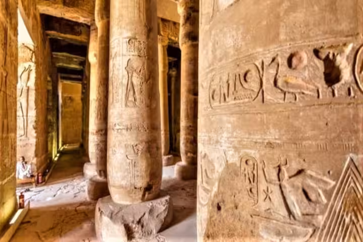 Hieroglyph-carved columns inside Dendera Temple, featured on the 2-day Amarna Beni Hassan Dendera and Abydos tour