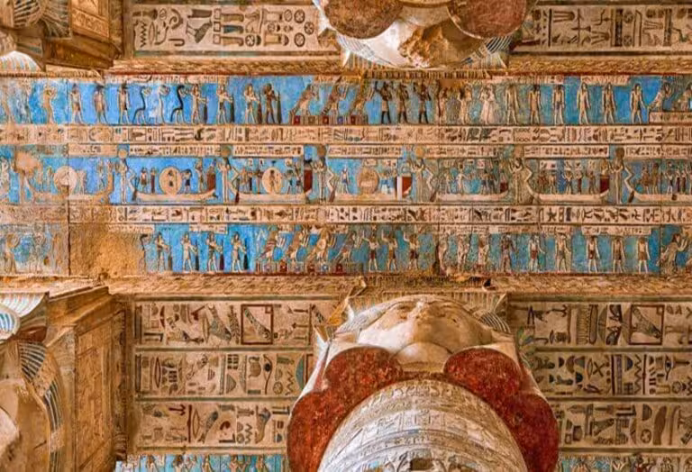 Colorful ceiling hieroglyphs and zodiac-style carvings inside Dendera Temple on full-day Dendera and Abydos tour