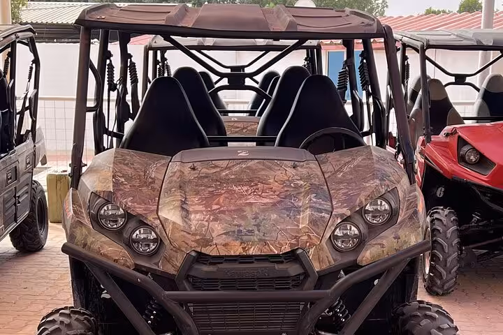 Camouflage dune buggy UTV ready for desert safari adventure, ideal for self-drive off-road dune ride tour