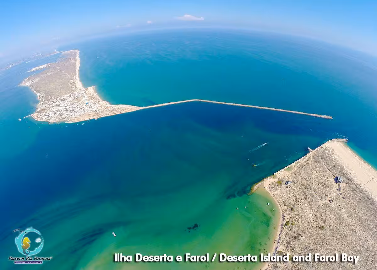 Aerial view of Deserta Island and Farol Bay with turquoise Ria Formosa channels on Olhao boat tour