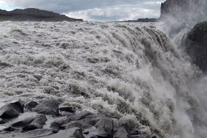 Powerful rushing waters of Dettifoss waterfall on the Diamond Circle tour in North Iceland