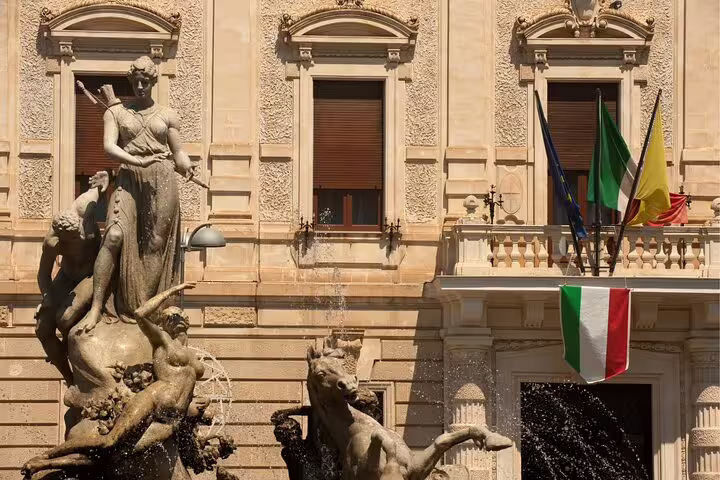 Close-up of Diana Fountain statues in Ortigia, Syracuse, on a self-guided scavenger hunt walking tour