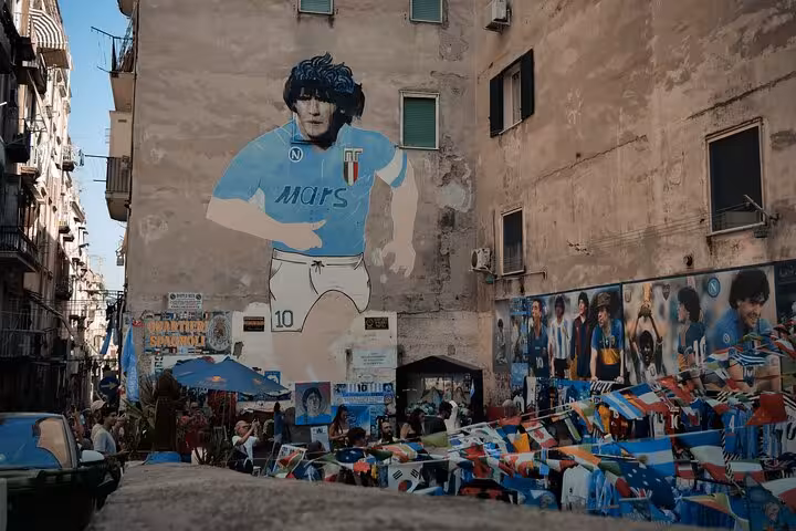Diego Maradona mural in Naples Quartieri Spagnoli, key stop on football culture and pizza legacy tour