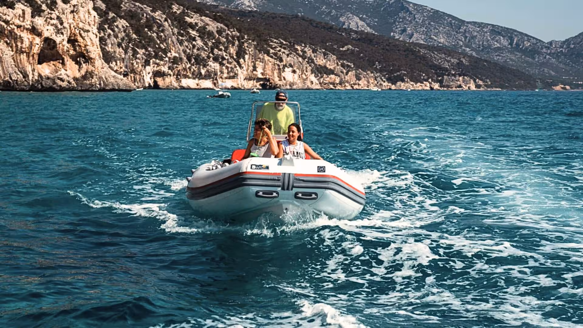 Enjoy an exhilarating dinghy ride along the scenic coastline from Cala Ginepro to Cala Goloritzè.