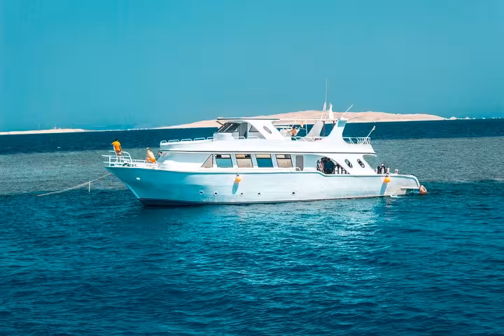 White dive boat cruising the Red Sea from Hurghada, Egypt, for beginner and certified scuba diving trips