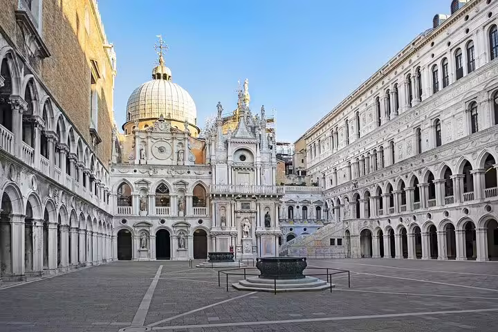 Quiet courtyard of Doge’s Palace in Venice with ornate domes and arches, featured on a last minute private walking tour