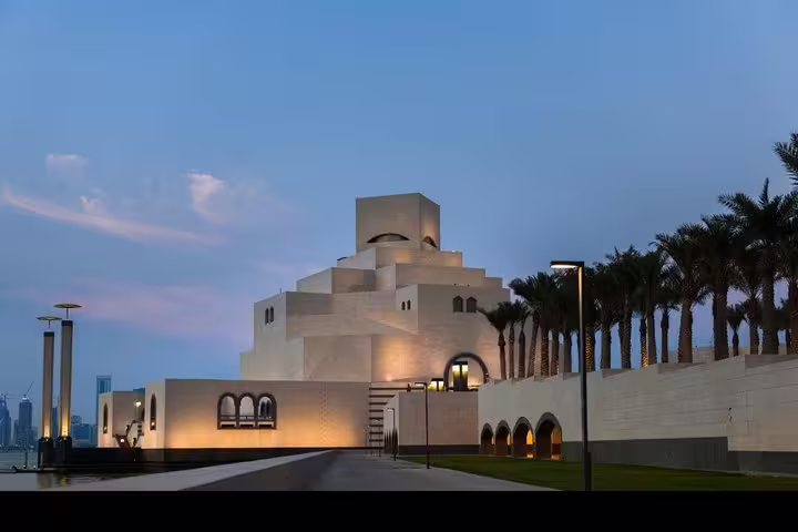 Stunning view of the Museum of Islamic Art in Doha at dusk, perfect for a personalized city tour itinerary.