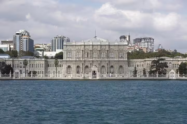 Dolmabahçe Palace viewed from the Bosphorus, showcasing its grand architecture on an Istanbul sightseeing tour.