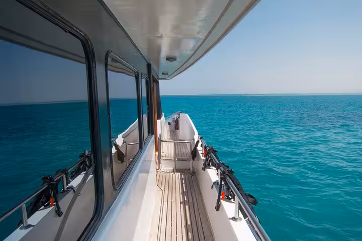 Boat deck view cruising turquoise Red Sea to Dolphin House from Hurghada for swim with dolphins and lunch