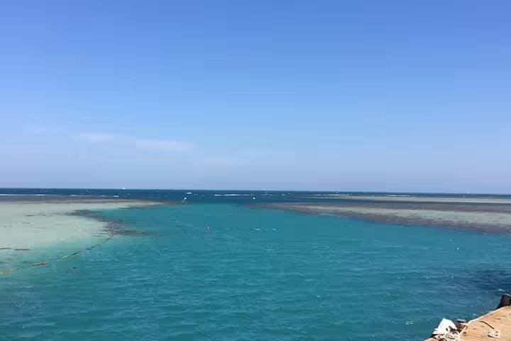 Turquoise lagoon and sandbanks at Dolphin House National Park, Red Sea, on a full-day snorkeling boat tour