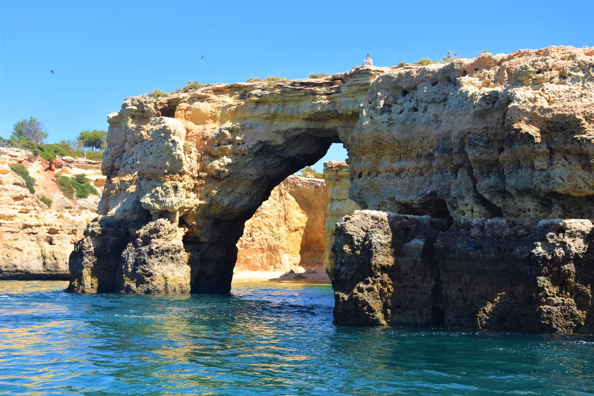 Explore stunning sea arches and rocky cliffs on the Dolphins and Caves tour, perfect for nature enthusiasts.