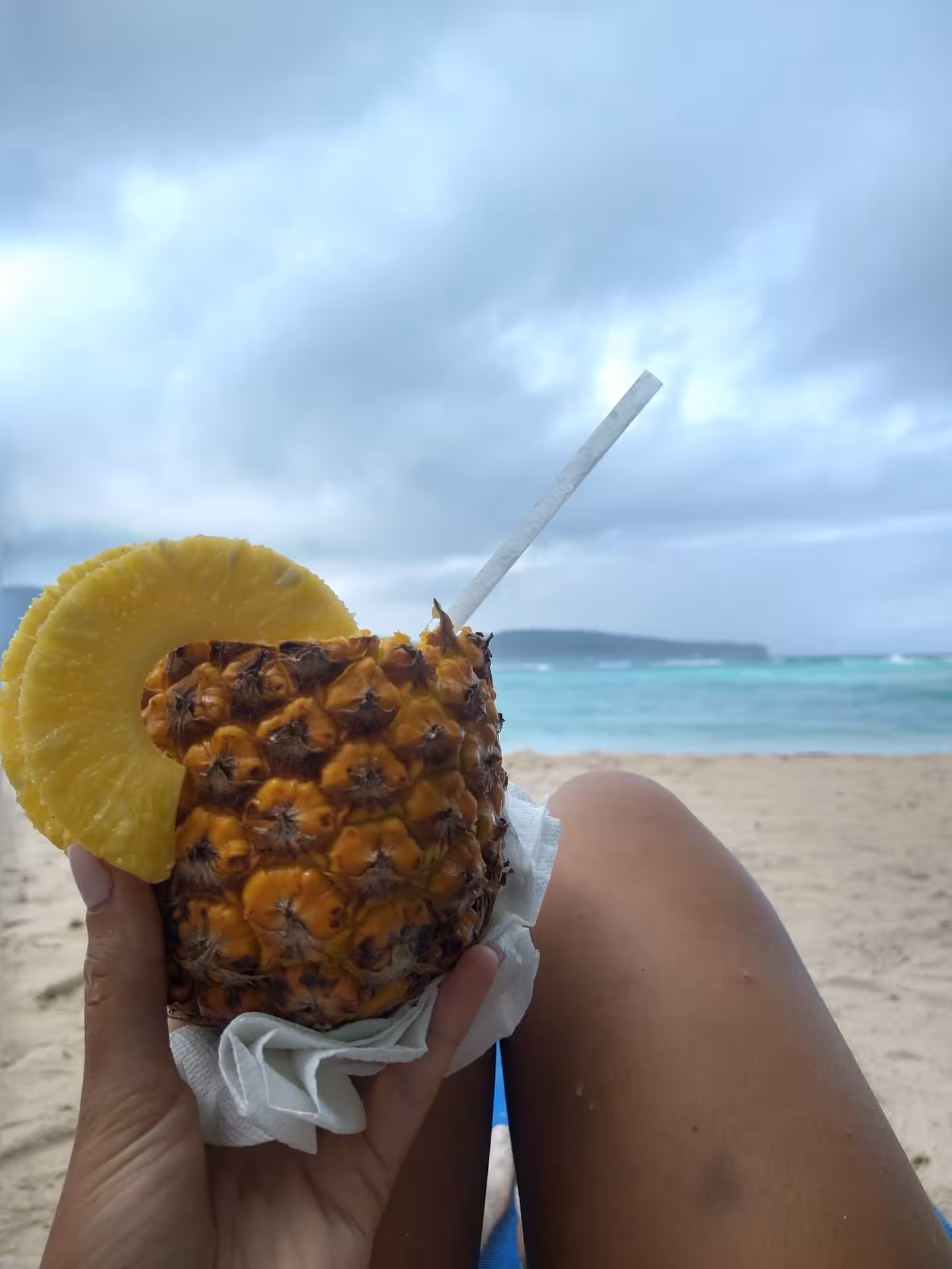 Fresh pineapple drink on a Dominican Republic beach, a tropical flavor stop on a culture immersion tour