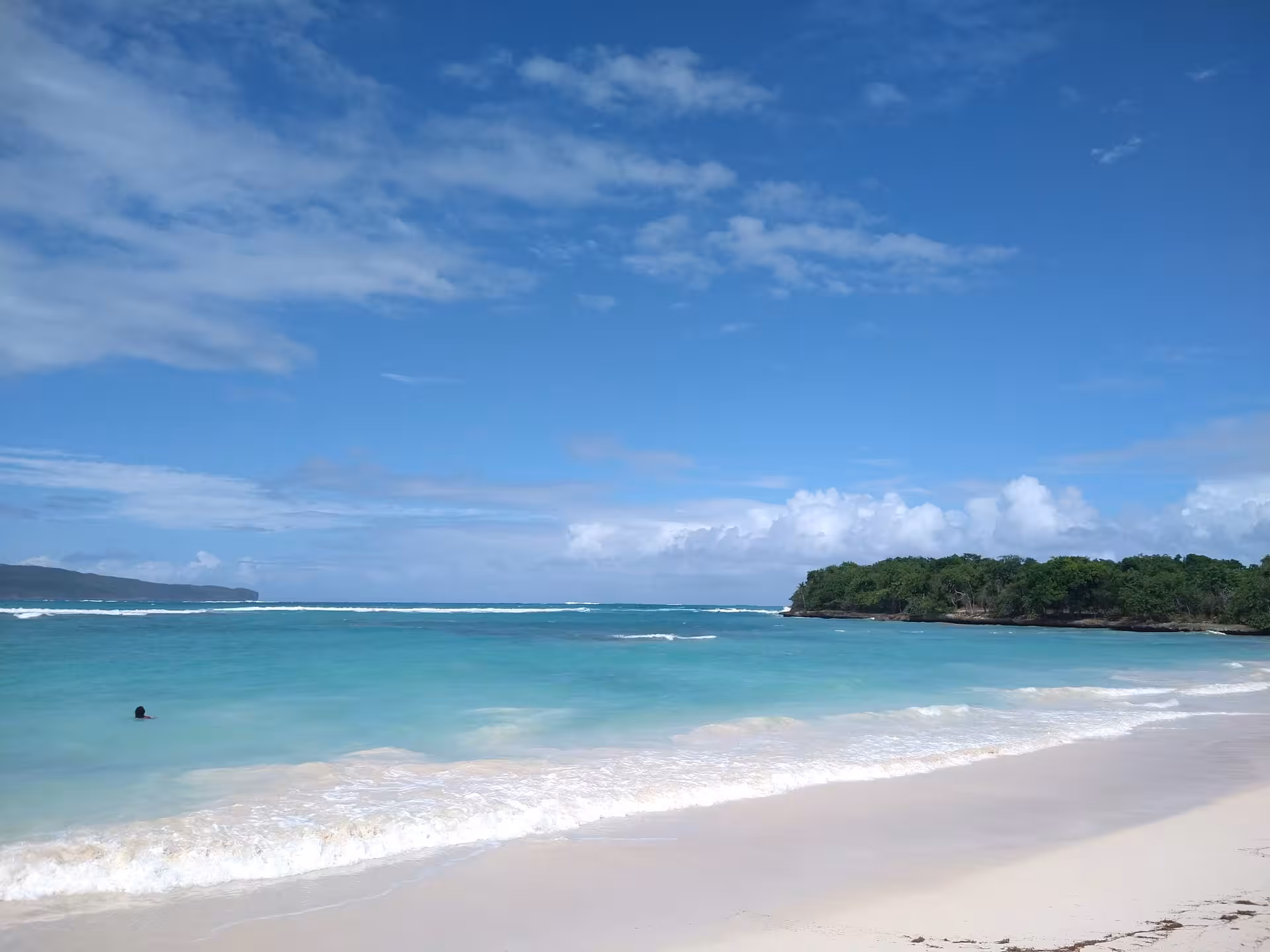 Turquoise Caribbean beach in the Dominican Republic, serene shoreline escape on a 7-day self-discovery tour