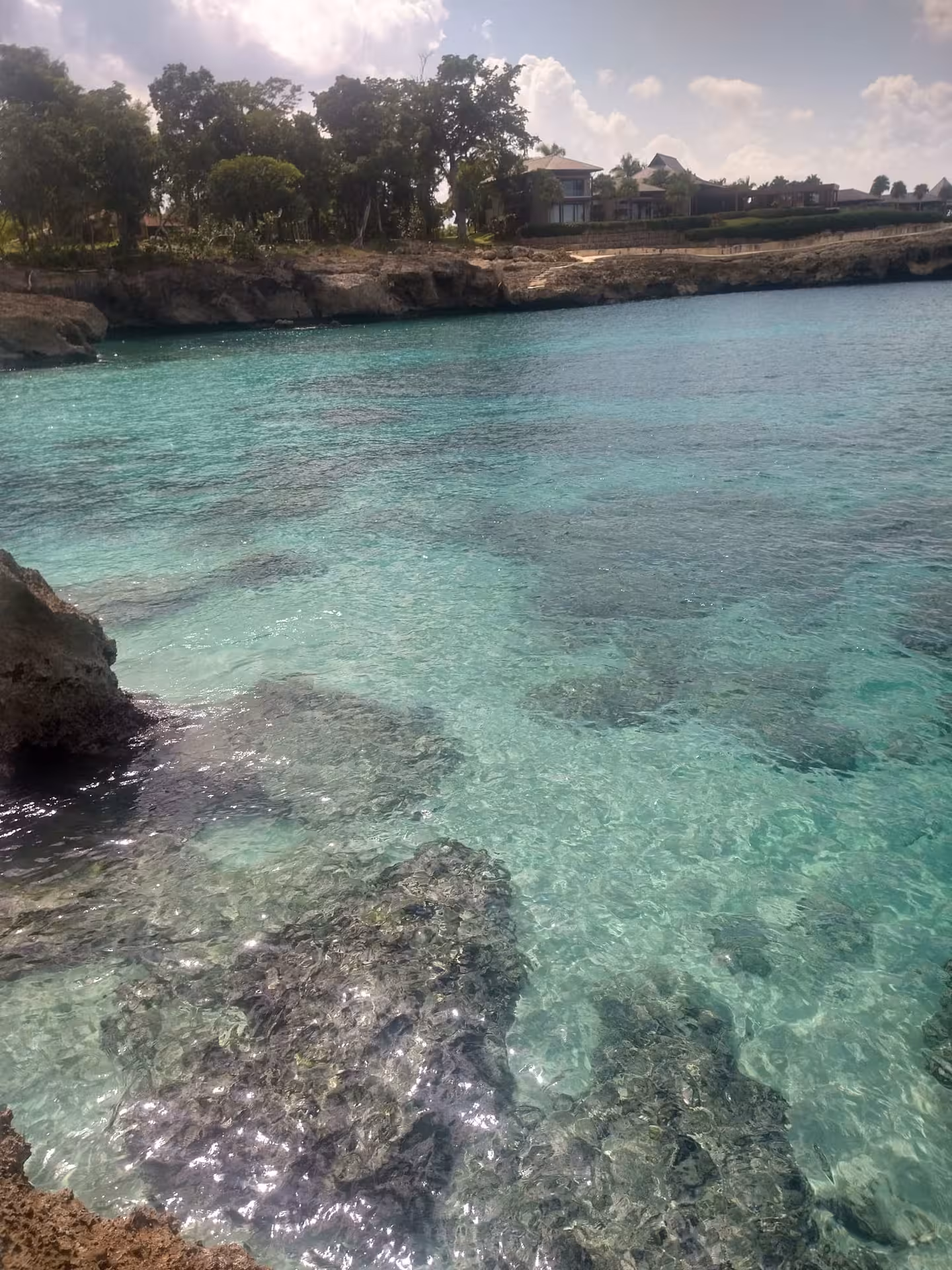 Crystal-clear turquoise cove on the Dominican Republic coast, Caribbean getaway with snorkeling and scenic shoreline views