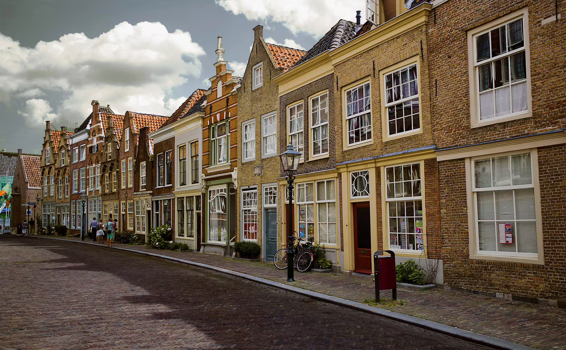 Historic Dordrecht street with gabled houses and cobblestones, perfect for a 1-day self-guided audio walking tour